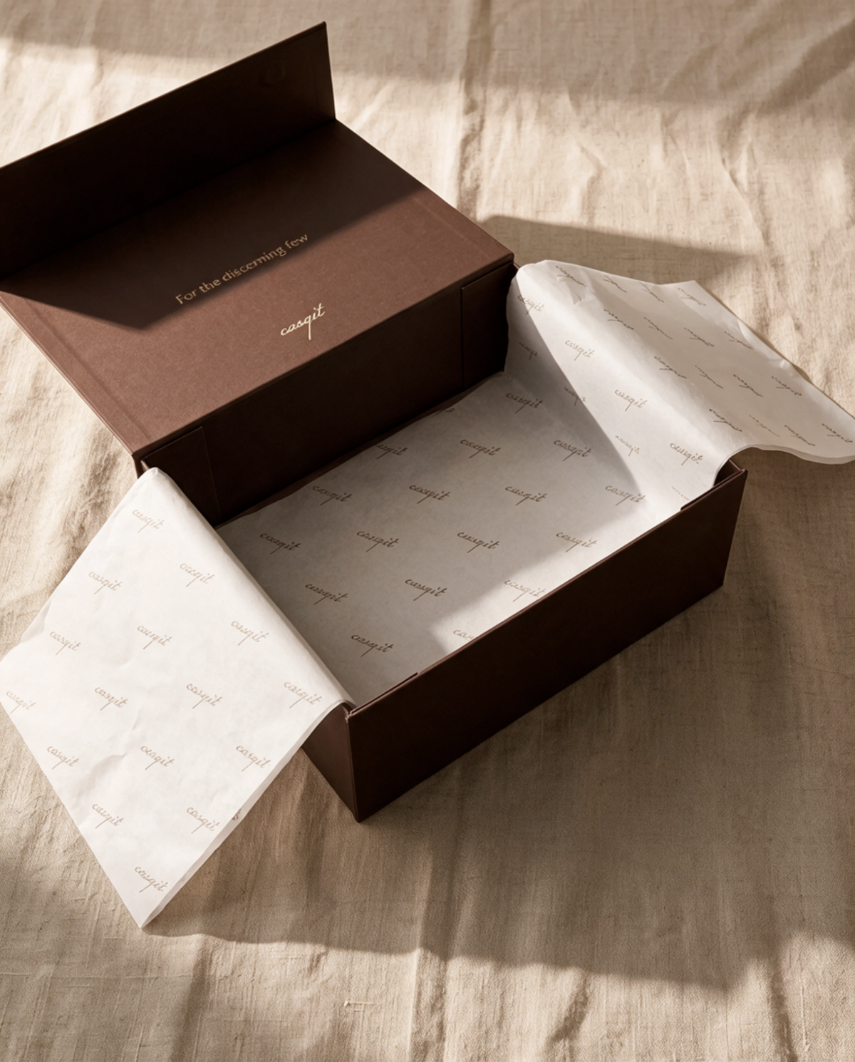 Open Casqit box with branded tissue paper